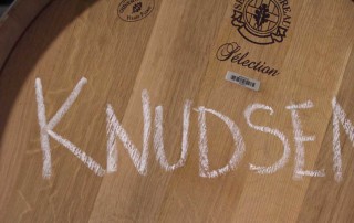 wine barrel with knudsen written on it