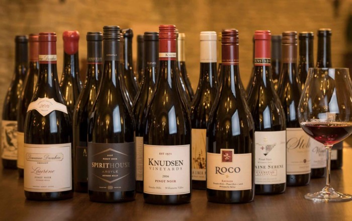 photo of many bottles of wine on a table